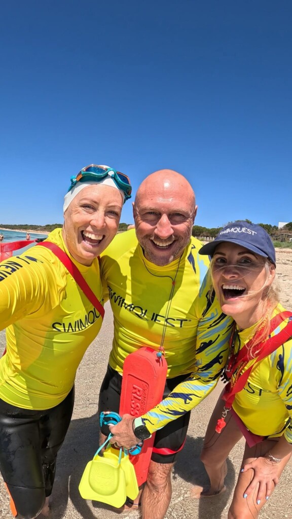 Three SwimQuest Guides wearing rash vests