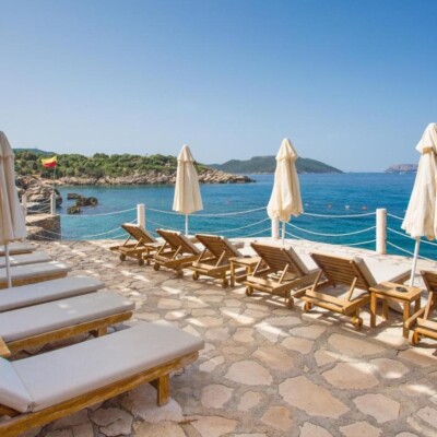 Aqua princess hotel in Turkey. View from the terrace. Sun loungers umbrellas and blue sea.