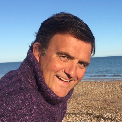 John Coningham-Rolls against a beach