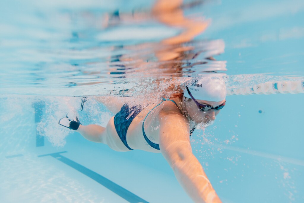 SWimmer as seen from under water in La Santa