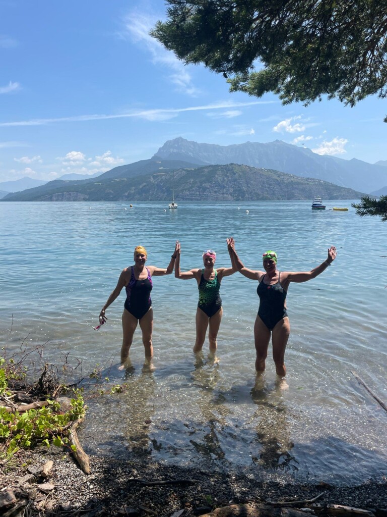 3 happy challengers at the end of the swim