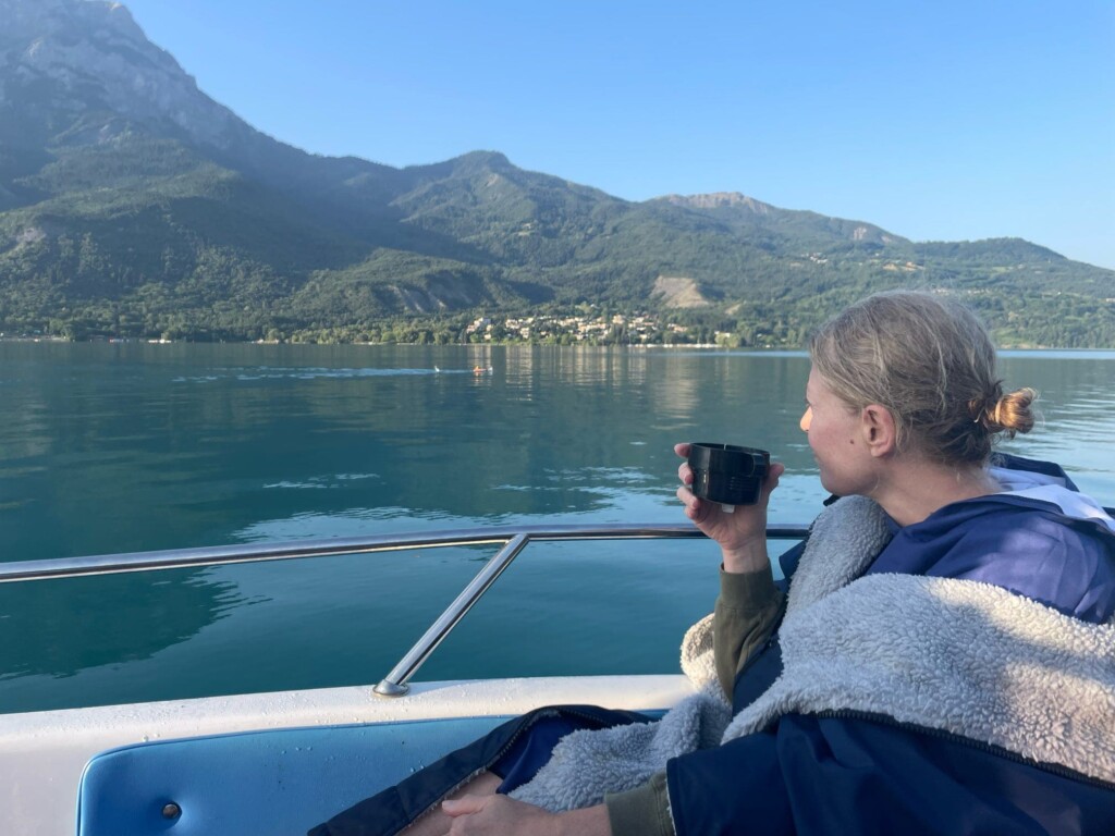 One swimmer take pause on boat on Lake Serre Pancon
