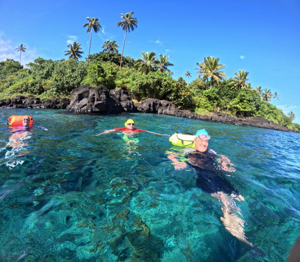 Swimmers relaxing in the ocean in fiji