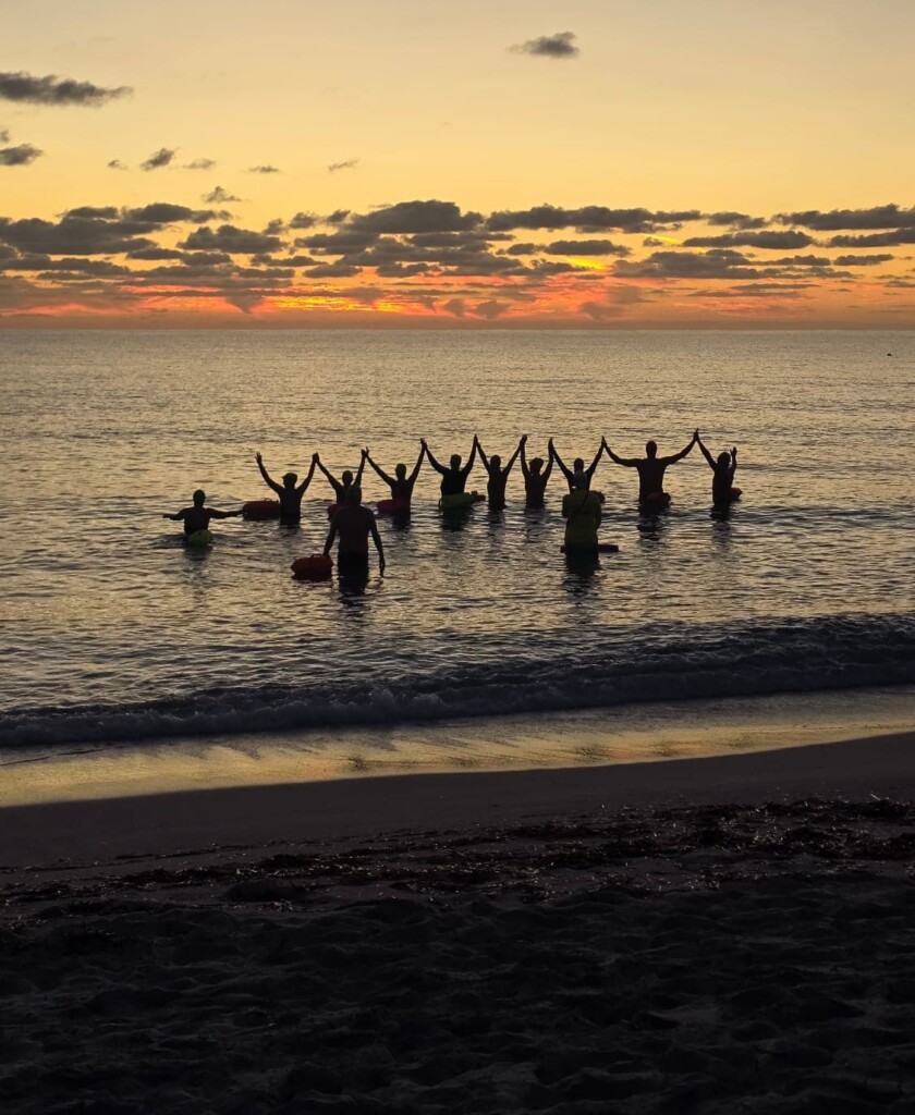 Swimmers at sunrise