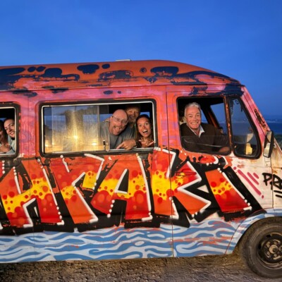 Happy family inside a van on Mathraki Island Greece