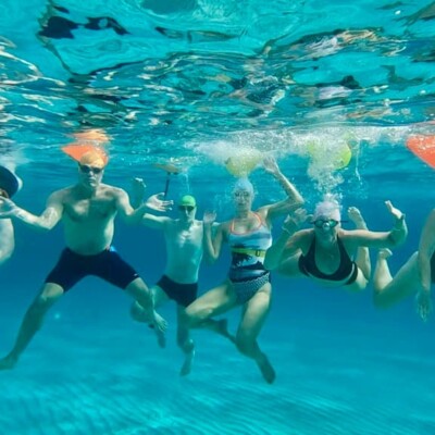 Groupd of swimmers under water at James Ewart technique coaching Formentera